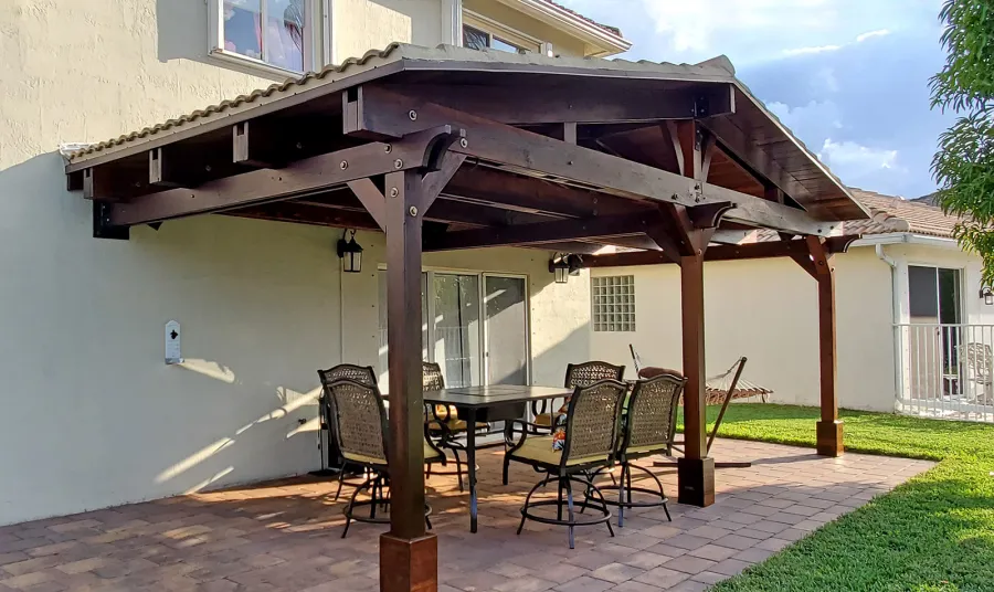 Forever Porch Pavilion (Options: 12' L x 25' W, California Redwood, 3-Post Anchor Kit for High-Wind, No Electrical Wiring Trim, 9ft Posts Height, No Ceiling Fan Base, No Curtain Rods, No Privacy Panels, Transparent Premium Sealant). Photo Courtesy of Carol Varela of Florida.