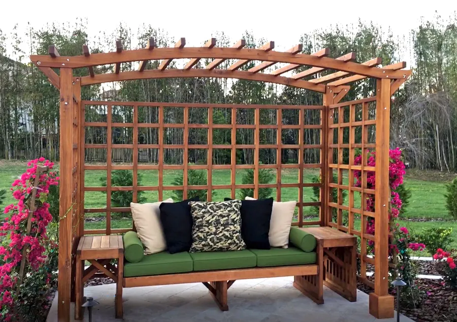 Custom Garden Arbor Bench (Options: 96" W x 5' D x 7'-1/4" H, Mature Redwood, Custom Bench with Side Tables, with Rear Side Trellis by Custom Request, 4-Post Anchor Kit, Transparent Premium Sealant). Photo Courtesy of S. Porcaro of Windermere, Florida.