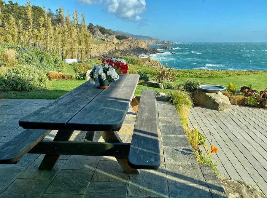 This table was built and delivered by founder Raul Hernandez in 2002 to Timber Cove. This style of Heritage table with 18' wide boards was discontinued because it was just too difficult to find sufficiently large reclaimed logs after 2009. The table is going strong after 20 years on the oceanfront!