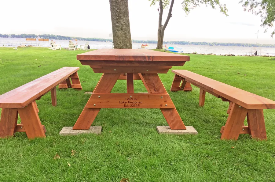 Heritage Large Wooden Picnic Table (Options: 10' L, 34 1/2" W, Side Benches, Unattached Benches, 1 Full Length Side Bench/Side, Standard Tabletop, Squared Corners, No Umbrella Hole, Transparent Premium Sealant). Engraving by Custom Request. Photo Courtesy of A. Perdue of Stoughton, WI.