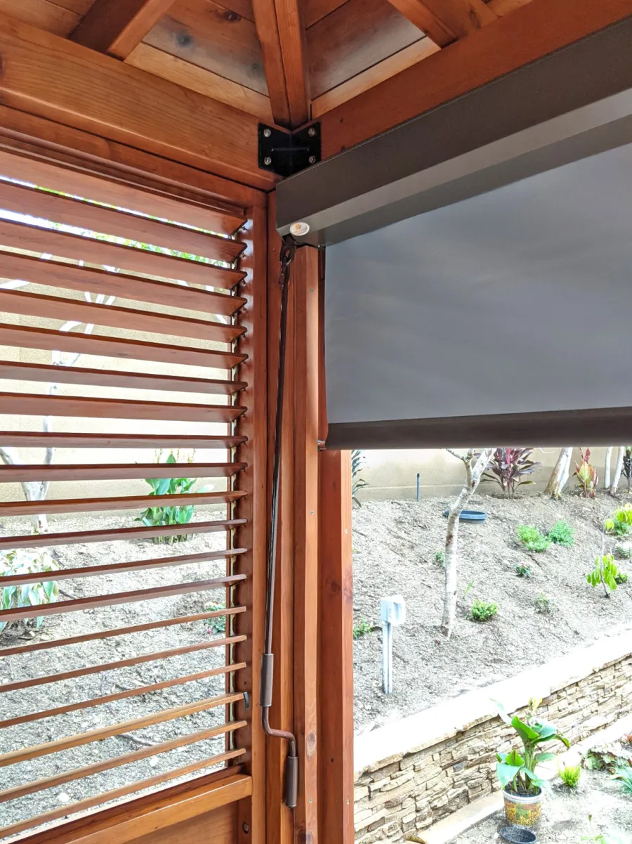 Hot Tub Enclosure Kits / Hot Tub Pavilion (Options: 12' x 16', Mature Redwood, Without Skylight, Custom Louvered Privacy Walls for the Top Half and Solid Wood Walls for the Bottom Half on 2 Sides, Transparent Premium Sealant). Photo Courtesy of J. Earney of San Diego, CA. Screen From North Solar Screen: https://northsolarscreen.com/outdoor-shades/blackout-total-privacy-shades/grande-blackout-heavy-duty/ 