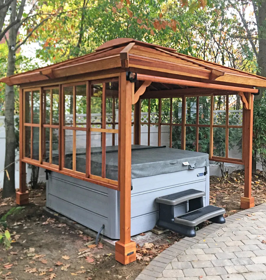 Hot Tub Enclosure Kits / Hot Tub Pavilion (Options: 10' x 10', California Redwood, 3' x 3' Skylight, Sliding Windows on 3 Sides [Clear Polycarbonate Windows by Custom Request], 30" H Windows Clearance, 1 Curtain Rod, 4-Post Kit for High-Wind, Transparent Premium Sealant). Photo Courtesy of T. Bohnert of Newtonville, Massachusetts.