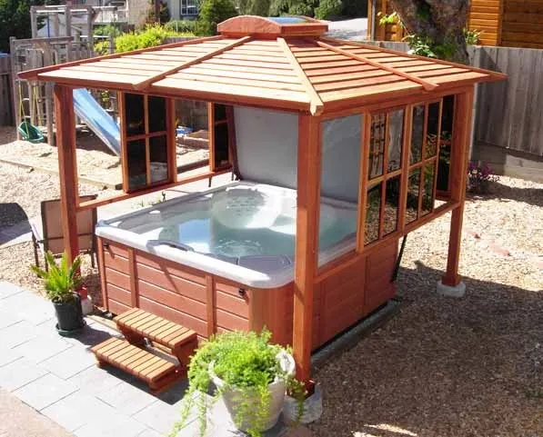 Hot Tub Enclosure Kits / Hot Tub Pavilion (Options: 9' x 9', California Redwood, Windows on 3 Sides, No Curtain Rods, 4-Post Anchor Kit for Stone, Transparent Premium Sealant). Photo Courtesy of John Grubb.