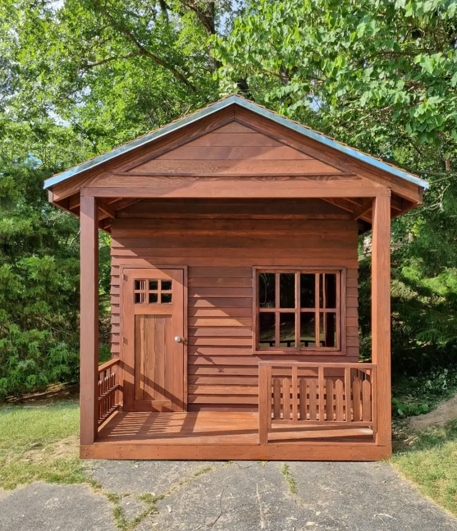 Kid's Backyard Cabin (Options: 14ft L x 10ft W, 8ft Wall H, Douglas-fir [Exterior Siding & Roofing in California Redwood by Custom Request], 4ft Front Porch Size [Included in the Overall Length], Interior Tongue & Groove Flooring, Shiplap Roof, Coffee-Stain Premium Sealant). Photo Courtesy of T. ONeill of Kimberling City, MO.