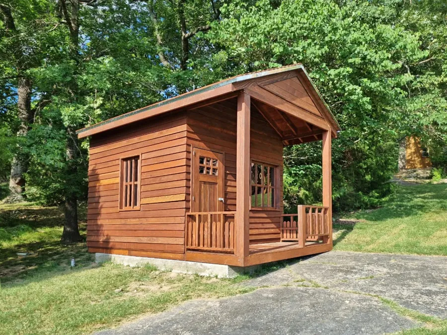Kid's Backyard Cabin (Options: 14ft L x 10ft W, 8ft Wall H, Douglas-fir [Exterior Siding & Roofing in California Redwood by Custom Request], 4ft Front Porch Size [Included in the Overall Length], Interior Tongue & Groove Flooring, Shiplap Roof, Coffee-Stain Premium Sealant). Photo Courtesy of T. ONeill of Kimberling City, MO.