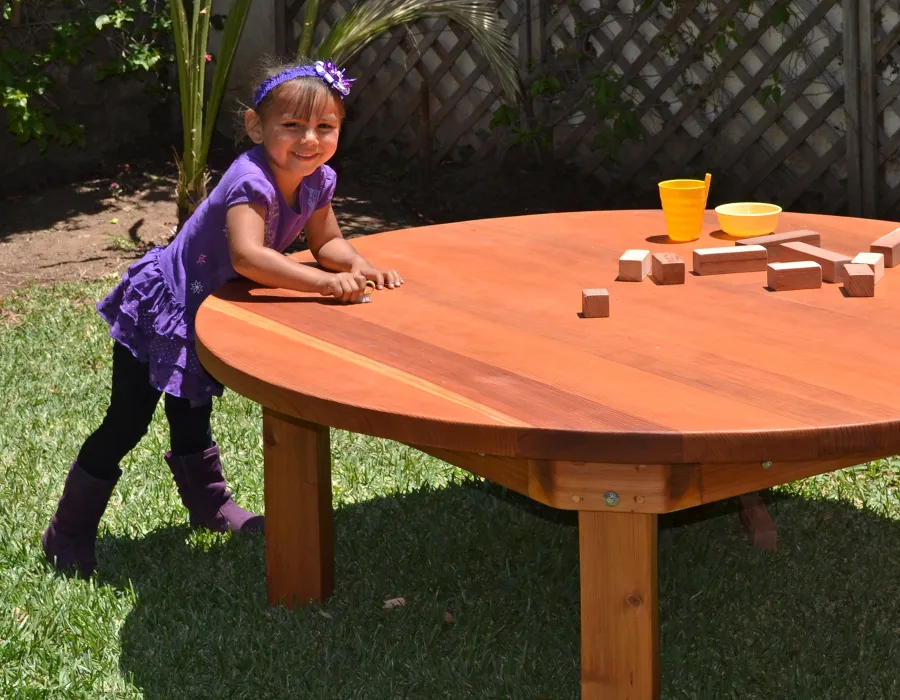 Kid's Round Outdoor Wood Table (Options: 5' Diameter, No Seating, California Redwood, Seamless Tabletop, Transparent Premium Sealant). 