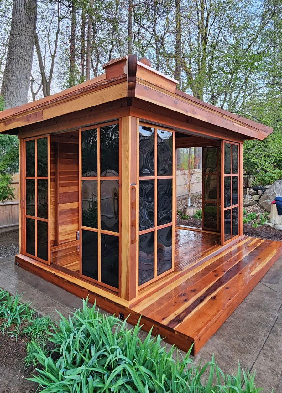 Kikue's Tea House (Options: 14 ft L x 10 ft W, 8' Wall Height, Wood Shingle Roof, California Redwood, 3 Sliding Walls and One Fixed Wood Wall, No Electrical Wiring Trim, with Wood Handle, Interior and External Decking, Transparent Premium Sealant). Photo Courtesy of A. Perry of Longmeadow, MA.