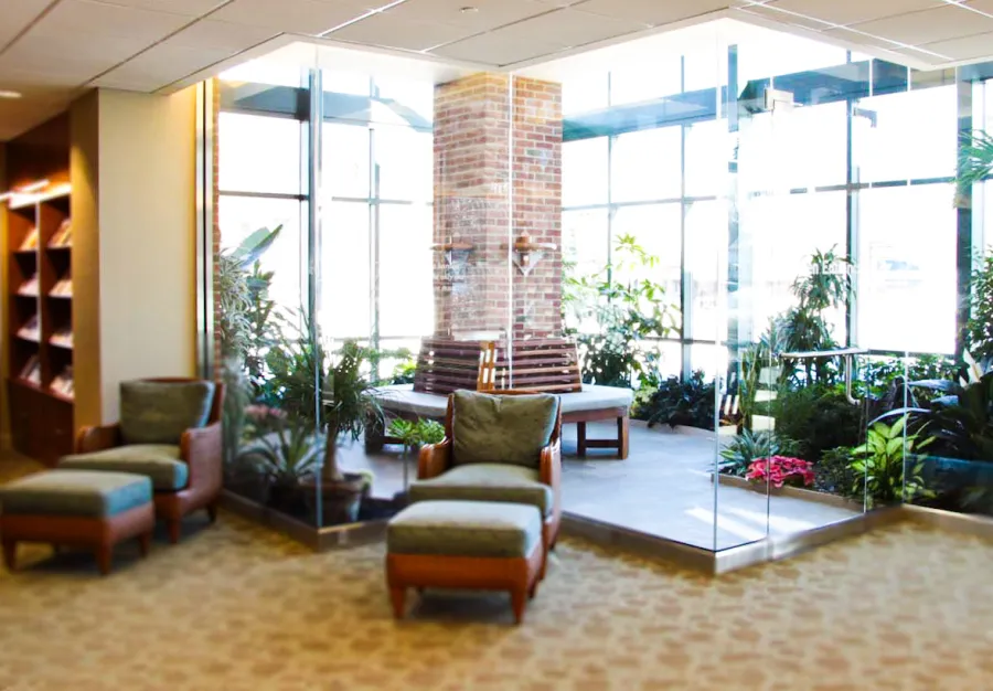Maria's Tree Benches (Options: 6 1/2', California Redwood, No Beverage Ledge, Add Custom Cushion, No Engraving, Transparent Premium Sealant). Photo Courtesy of ECHN Hospital, Manchester CT 06040.  