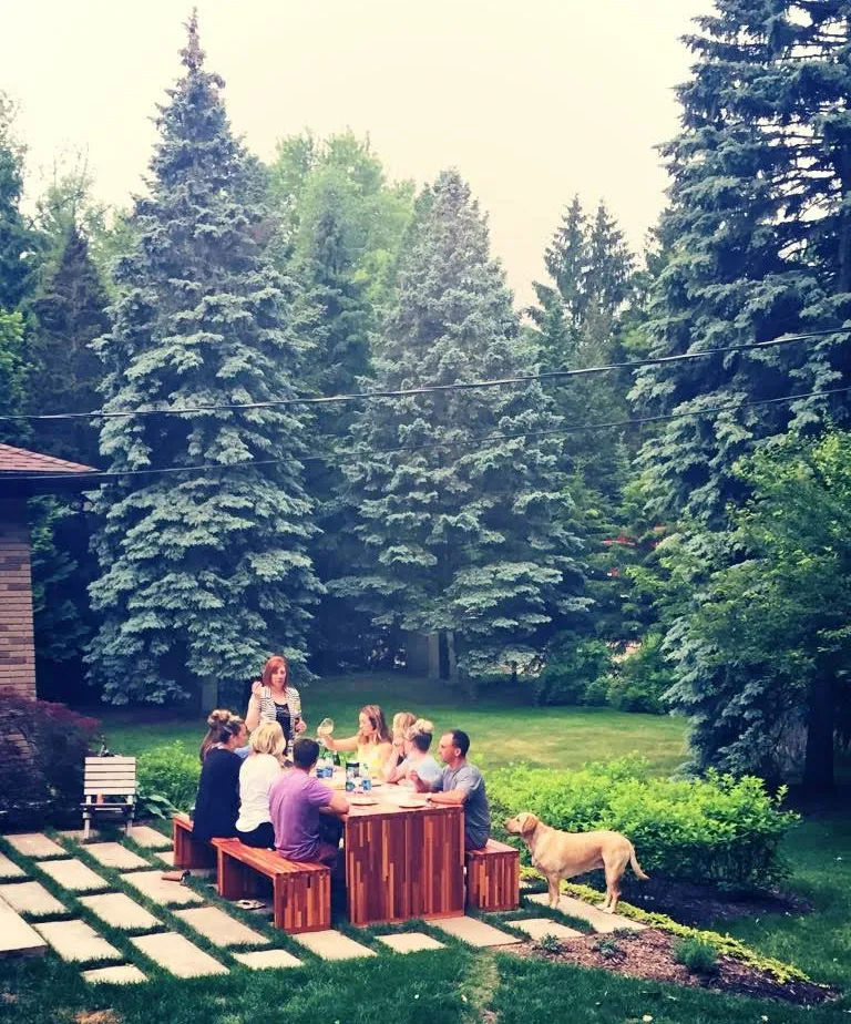 Maynard Modern Redwood Patio Table (Options: 8' L, 34 1/2" W Tabletop, Side Benches, Mosaic Redwood, 2 Half Length Maynard Benches Per Side, Standard Tabletop, 1 5/8" Diameter Umbrella Hole, Transparent Premium Sealant). Photo Courtesy of Sarah D'Agostino of Novi, Michigan.