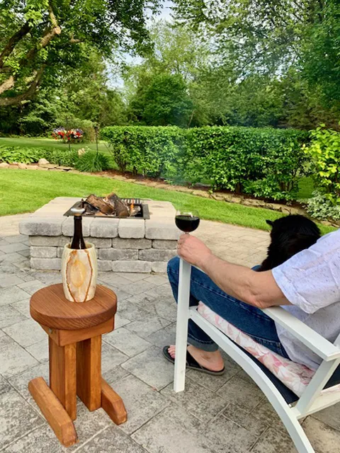 Mini 12 Inch Round Wood Side Table (Options: California Redwood, 18 inches Tall, Transparent Premium Sealant, Base Timbers 14" Long by Custom Request). Photo Courtesy of K. M. Wells of Oswego, New York.