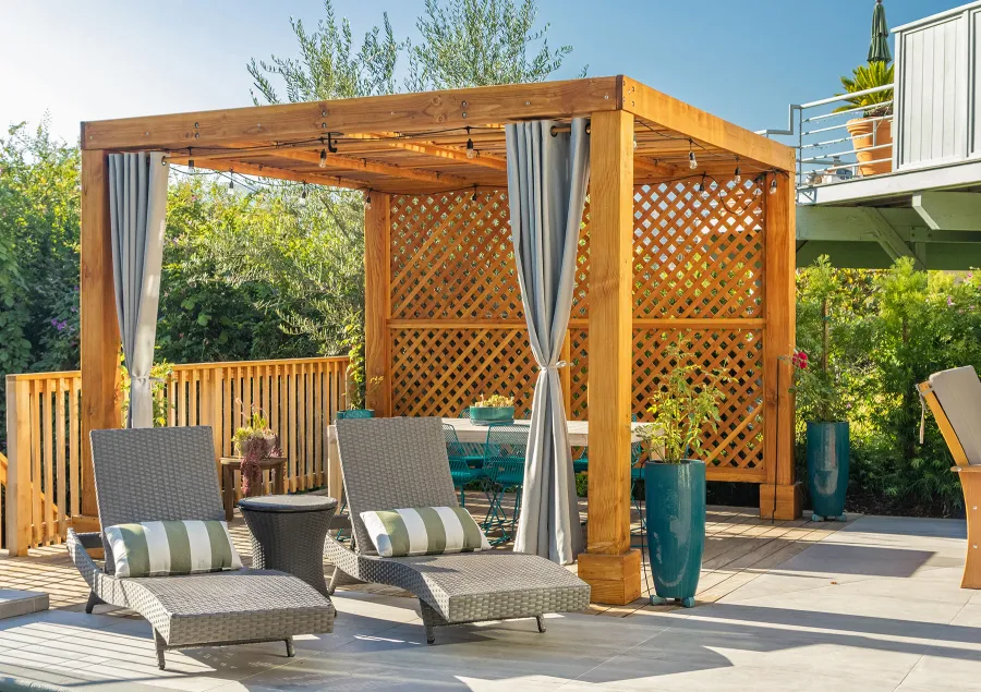 Modern Louvered Garden Pergola (Options: 12' L x 12' W, 8'' x 8'' Posts, Mobile Louvers, Douglas-fir, with 1 Lattice Privacy Wall, Electrical Wiring Trim for 1 Post, Without Fascia, No Curtain Rods, 4 Post Anchor Kit for Wood, No Post Decorative Trims, No Ceiling Fan Base, Transparent Premium Sealant). Photo Courtesy of S. Weinswig of Los Angeles, CA.