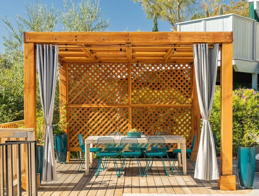 Modern Louvered Garden Pergola (Options: 12' L x 12' W, 8'' x 8'' Posts, Mobile Louvers, Douglas-fir, with 1 Lattice Privacy Wall, Electrical Wiring Trim for 1 Post, Without Fascia, No Curtain Rods, 4 Post Anchor Kit for Wood, No Post Decorative Trims, No Ceiling Fan Base, Transparent Premium Sealant). Photo Courtesy of S. Weinswig of Los Angeles, CA.