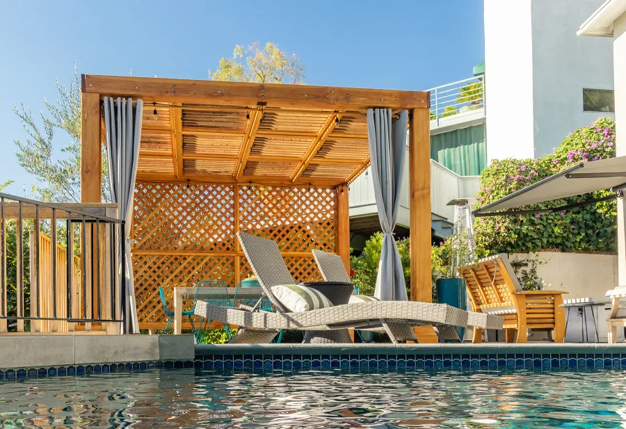Modern Louvered Garden Pergola (Options: 12' L x 12' W, 8'' x 8'' Posts, Mobile Louvers, Douglas-fir, with 1 Lattice Privacy Wall, Electrical Wiring Trim for 1 Post, Without Fascia, No Curtain Rods, 4 Post Anchor Kit for Wood, No Post Decorative Trims, No Ceiling Fan Base, Transparent Premium Sealant). Photo Courtesy of S. Weinswig of Los Angeles, CA.