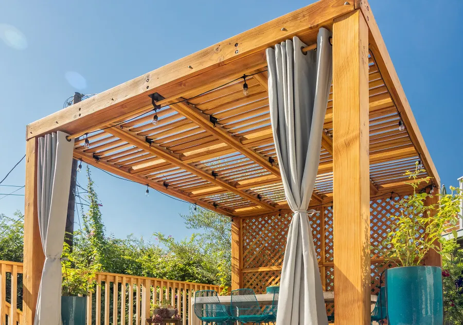 Modern Louvered Garden Pergola (Options: 12' L x 12' W, 8'' x 8'' Posts, Mobile Louvers, Douglas-fir, with 1 Lattice Privacy Wall, Electrical Wiring Trim for 1 Post, Without Fascia, No Curtain Rods, 4 Post Anchor Kit for Wood, No Post Decorative Trims, No Ceiling Fan Base, Transparent Premium Sealant). Photo Courtesy of S. Weinswig of Los Angeles, CA.