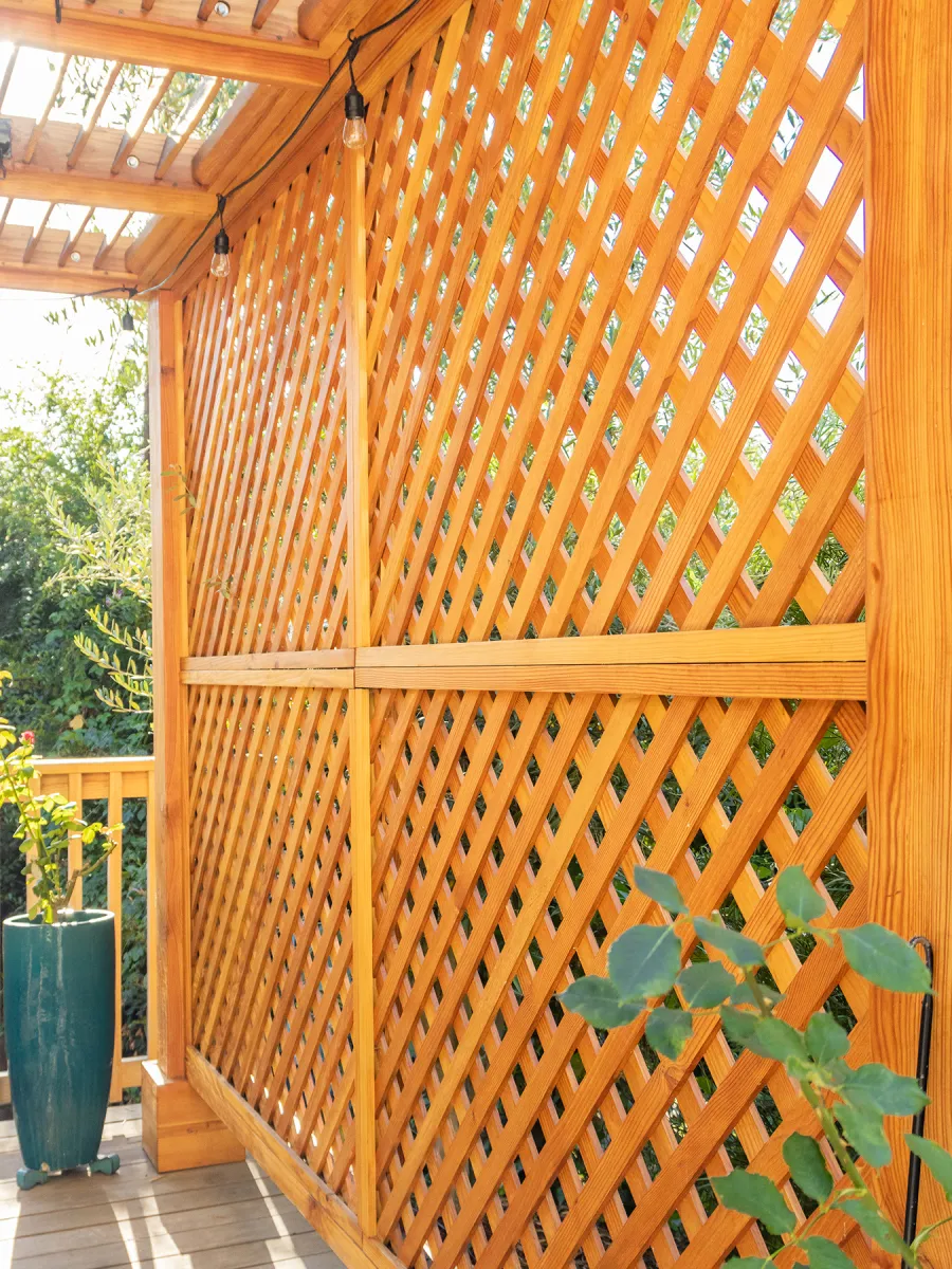 Modern Louvered Garden Pergola (Options: 12' L x 12' W, 8'' x 8'' Posts, Mobile Louvers, Douglas-fir, with 1 Lattice Privacy Wall, Electrical Wiring Trim for 1 Post, Without Fascia, No Curtain Rods, 4 Post Anchor Kit for Wood, No Post Decorative Trims, No Ceiling Fan Base, Transparent Premium Sealant). Photo Courtesy of S. Weinswig of Los Angeles, CA.