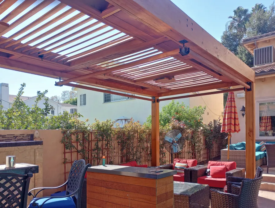 Modern Louvered Garden Pergola (Options: 25' L x 10' W, 8'' x 8'' Posts, Mobile Louvers, Douglas-fir, No Privacy Wall, Electrical Wiring Trim for 2 Posts, Without Fascia, 4 Curtain Rods, 4 Post Anchor Kit for Concrete, No Post Decorative Trims, 2 Ceiling Fan Bases, Transparent Premium Sealant). Photo Courtesy of B. Hamideh of Studio City, CA.