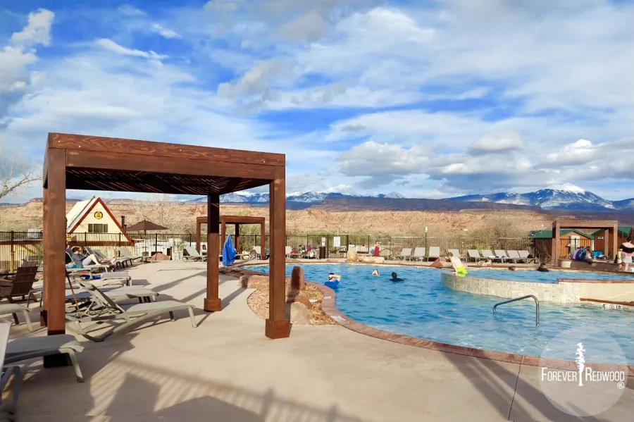 Modern Louvered Garden Pergola (Options: 10' L x 10' W, 8'' x 8'' Posts, Mobile Louvers, Douglas-fir, 9.5 ft H, No Electrical Wiring Trim, 4 Curtain Rods, 4 Post Anchor Kit for Concrete, No Post Decorative Trims, No Ceiling Fan Bases, Coffee-Stain Premium Sealant). Photo Courtesy of D. Tuzi of Moab, Utah.