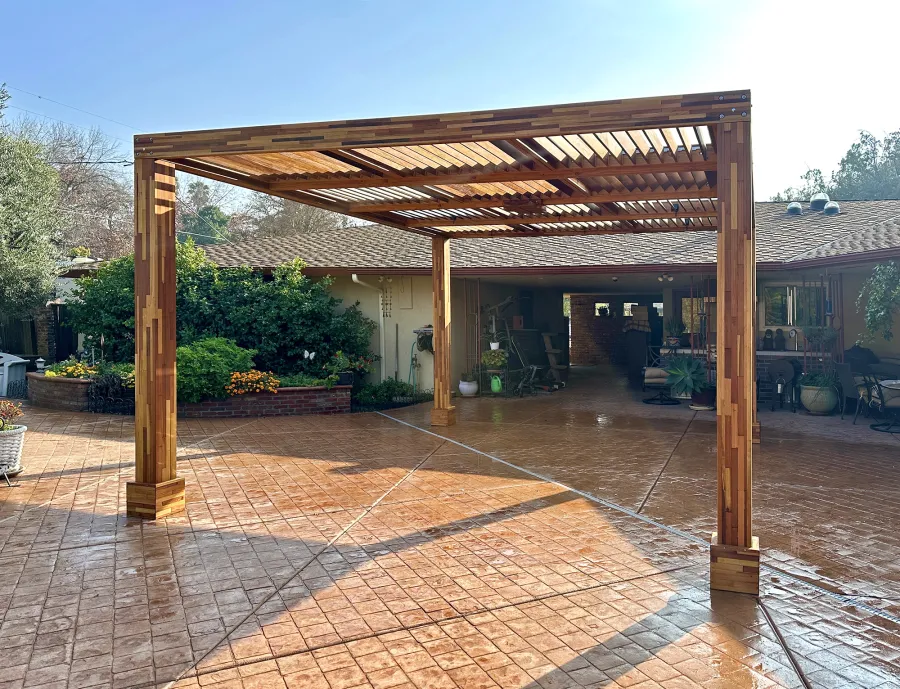 Modern Louvered Garden Pergola (Options: 16' L x 14' W, 8'' x 8'' Posts, Mobile Louvers, Mosaic Redwood, 9.5 ft H, No Electrical Wiring Trim, No Curtain Rods, 4 Post Anchor Kit for Concrete, No Post Decorative Trims, 1 Ceiling Fan Base, Transparent Premium Sealant). Photo Courtesy of J. Holmquist of Madera, CA.