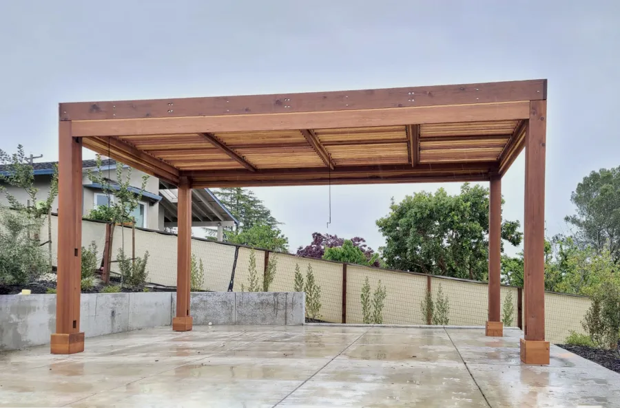 Modern Louvered Garden Pergola (Options: 20' L x 10' W, 8'' x 8'' Posts, Mobile Louvers, California Redwood, No Privacy Wall, Electrical Wiring Trim for 2 Posts, With Fascia, 4 Curtain Rods, 4 Post Anchor Kit for Concrete, No Post Decorative Trims, No Ceiling Fan Base, Transparent Premium Sealant). Photo Courtesy of J. Holder of Lafayette, CA.