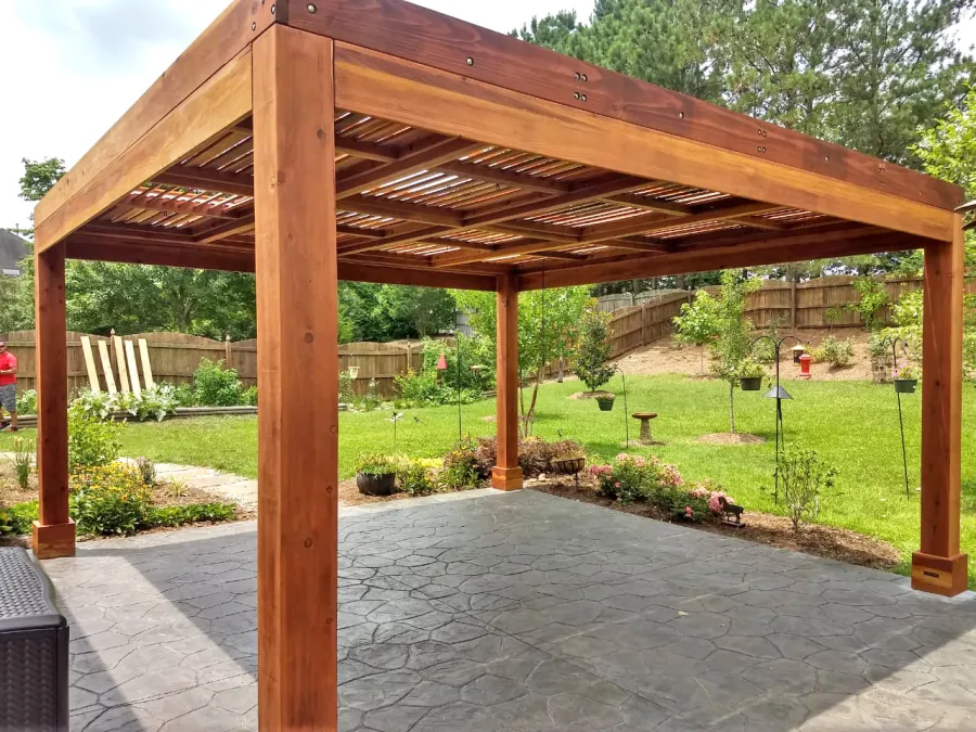 Modern Louvered Garden Pergola (Options: 16' L x 16' W, 8'' x 8'' Posts, Mobile Louvers, California Redwood, 9 ft H, No Electrical Wiring Trim, No Curtain Rods, 4 Post Anchor Kit for Concrete, No Post Decorative Trims, No Ceiling Fan Base, Transparent Premium Sealant). Photo Courtesy of J. McLaughlin of Cary, North Carolina.