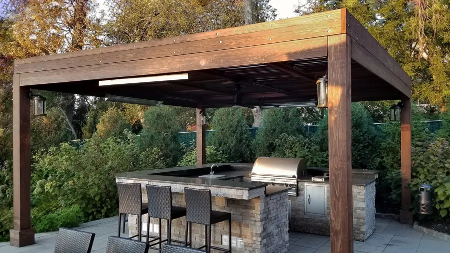 Modern Louvered Garden Pergola (Options: 18' L x 18' W, 8'' x 8'' Posts, Mobile Louvers, California Redwood, 10 ft H, 1 Electrical Wiring Trim, No Curtain Rods, 4 Post Anchor Kit for Concrete, No Post Decorative Trims, 1 Ceiling Fan Base, Coffee-Stain Premium Sealant). Photo shows faded finish - installation was completed 2 years prior. Photo Courtesy of C. Passmore of Lawrence, New York.