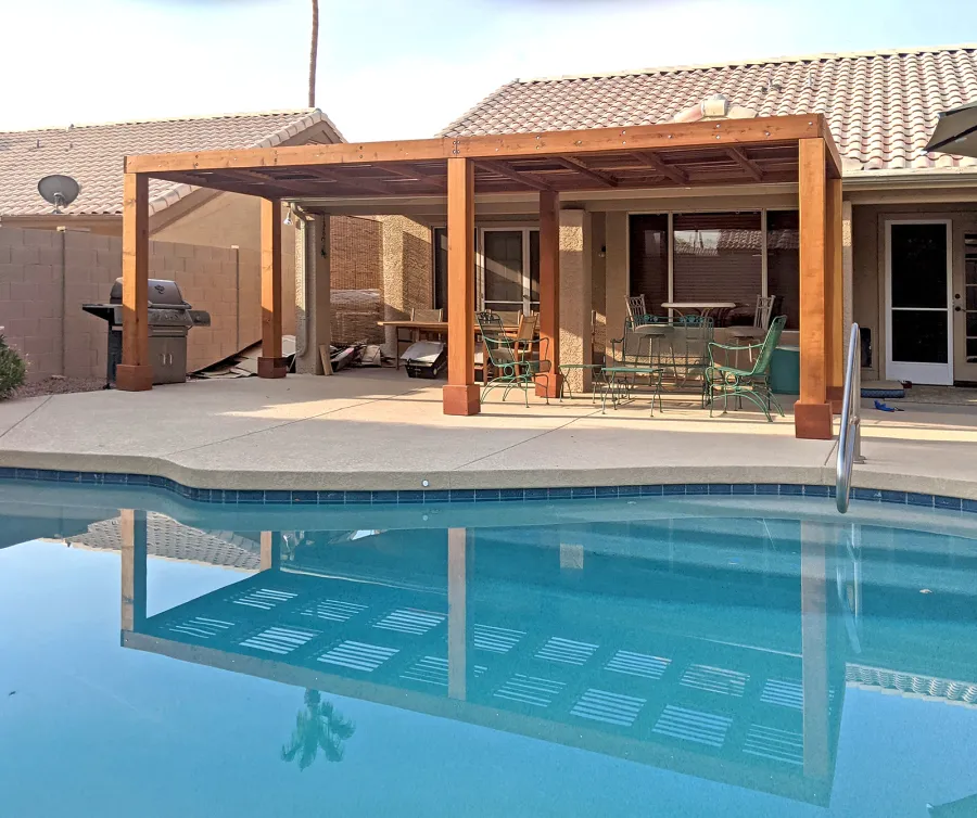 Modern Louvered Garden Pergola (Options: 24' L x 8' W, 8'' x 8'' Posts, Mobile Louvers, California Redwood, 8 ft H, No Electrical Wiring Trim, No Curtain Rods, 6 Post Anchor Kit for Concrete, No Post Decorative Trims, No Ceiling Fan Base, Transparent Premium Sealant). Photo Courtesy of K. St. John of Phoenix, Arizona.