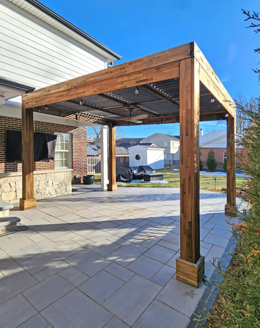 Modern Louvered Garden Pergola (Options: 14' L x 10' W, 8'' x 8'' Posts, Mobile Louvers, Mosaic Redwood, 9.5 ft H, Electrical Wiring Trim Kit for 1 Post, No Curtain Rods, Post Anchor Kit for Concrete, No Post Decorative Trims, 1 Ceiling Fan Base, Custom Weather Gray Finish Treatment). Photo Taken 1 Year After Installation. Photo Courtesy of M. Cleary of St. Louis, MO.