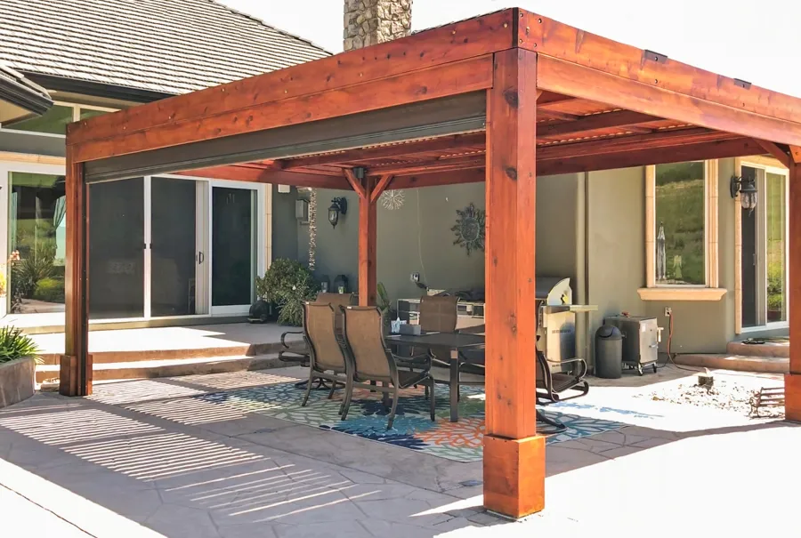 Modern Louvered Garden Pergola (Options: 20' L x 15' W, 8'' x 8'' Posts, Mobile Louvers, Mature Redwood, 9.5 ft H, 1 Electrical Wiring Trim, 4-Post Anchor Kit for High-Wind, No post decorative trims, No Ceiling Fan Base, Transparent Premium Sealant). Retractable Motorized Shade is a Sunroll from Sunesta Retractable Screens, for more information: https://www.sunesta.com/products/the-sunroll. Photo Courtesy of D. Ruprecht of Hollister, CA.