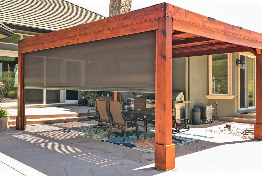 Modern Louvered Garden Pergola (Options: 20' L x 15' W, 8'' x 8'' Posts, Mobile Louvers, Mature Redwood, 9.5 ft H, 1 Electrical Wiring Trim, 4-Post Anchor Kit for High-Wind, No post decorative trims, No Ceiling Fan Base, Transparent Premium Sealant). Retractable Motorized Shade is a Sunroll from Sunesta Retractable Screens, for more information: https://www.sunesta.com/products/the-sunroll. Photo Courtesy of D. Ruprecht of Hollister, CA.