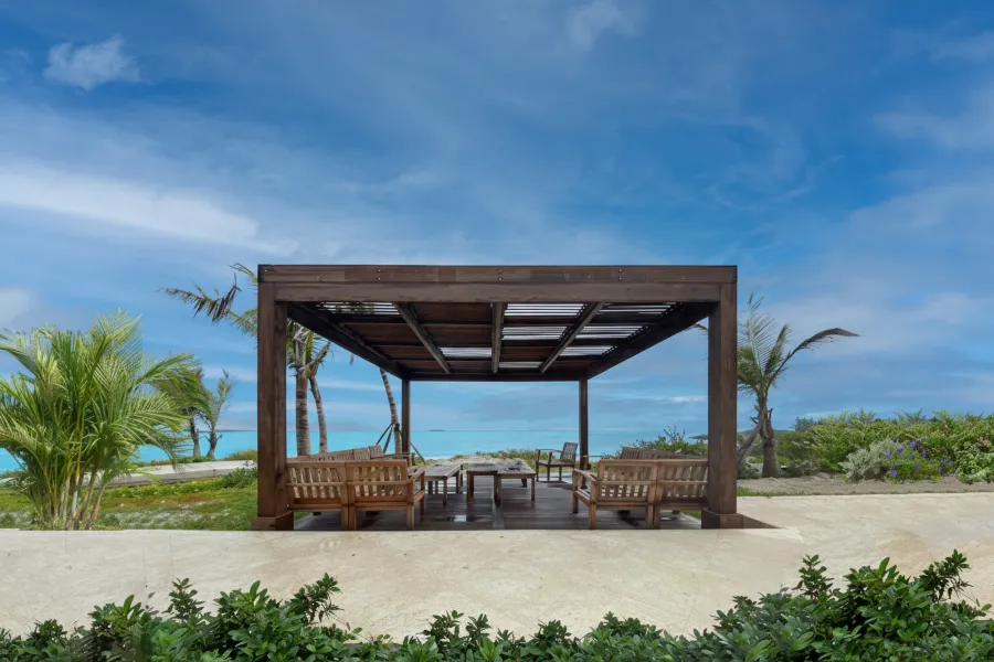 Modern Louvered Garden Pergola (Options: 16' L x 16' W, 8'' x 8'' Posts, Mobile Louvers, Mature Redwood, 9.5 ft H, No Electrical Wiring Trim, No Curtain Rods, 4 Post Anchor Kit for High-Wind, No Post Decorative Trims, No Ceiling Fan Base, Coffee-Stain Premium Sealant). Photo Courtesy of R. Dercks of Ft. Lauderdale, Florida.