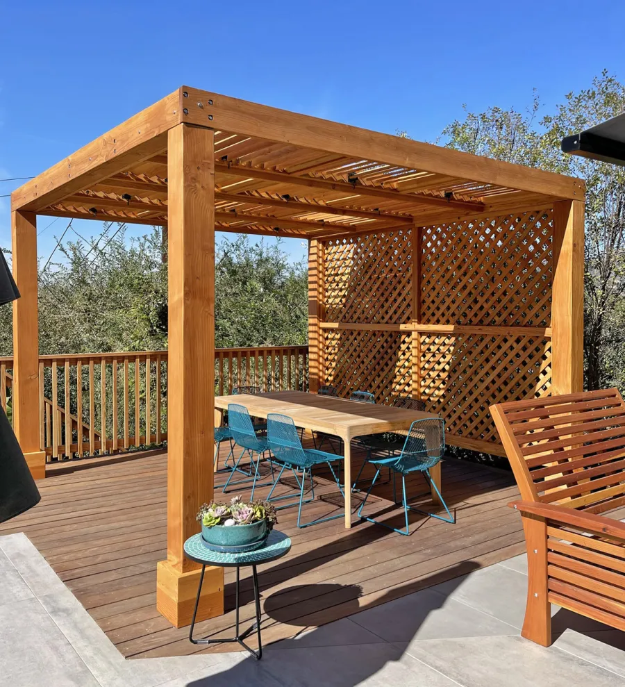 Modern Louvered Garden Pergola (Options: 12' L x 12' W, 8'' x 8'' Posts, Mobile Louvers, Douglas-fir, with 1 Lattice Privacy Wall, Electrical Wiring Trim for 1 Post, Without Fascia, No Curtain Rods, 4 Post Anchor Kit for Wood, No Post Decorative Trims, No Ceiling Fan Base, Transparent Premium Sealant). Photo Courtesy of S. Weinswig of Los Angeles, CA.
