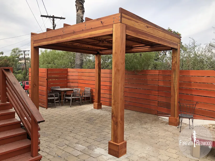 Modern Louvered Garden Pergola (Options: 10' L x 12' W, 8'' x 8'' Posts, Mobile Louvers, California Redwood, 9 ft H, Electrical Wiring Trim for 2 Posts, 4 Post Anchor Kit for Concrete, No post decorative trims, With a Ceiling Fan Base, Transparent Premium Sealant, 5 Slats with Slope on Top by Custom Request). Photo Courtesy of A. Carcieri of Los Angeles, CA.