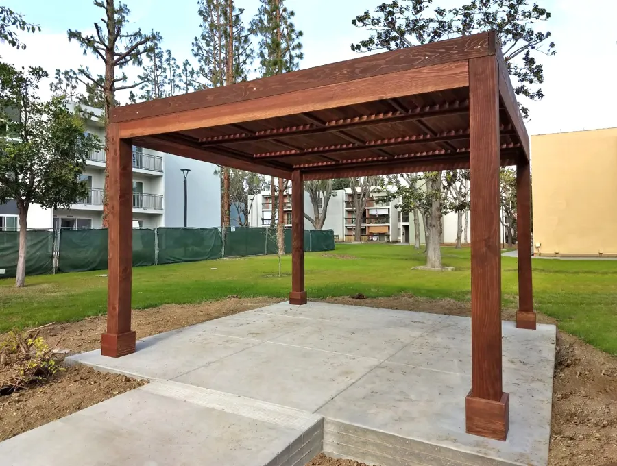 Modern Louvered Garden Pergola (Options: 14' L x 14' W, 8'' x 8'' Posts, Fixed Louvers, California Redwood, 9.5 ft H, No Electrical Wiring Trim, 4 Post Anchor Kit for Concrete, No post decorative trims, With a Ceiling Fan Base, Coffee-Stain Premium Sealant). Photo Courtesy of M. Ramirez of Long Beach, CA.