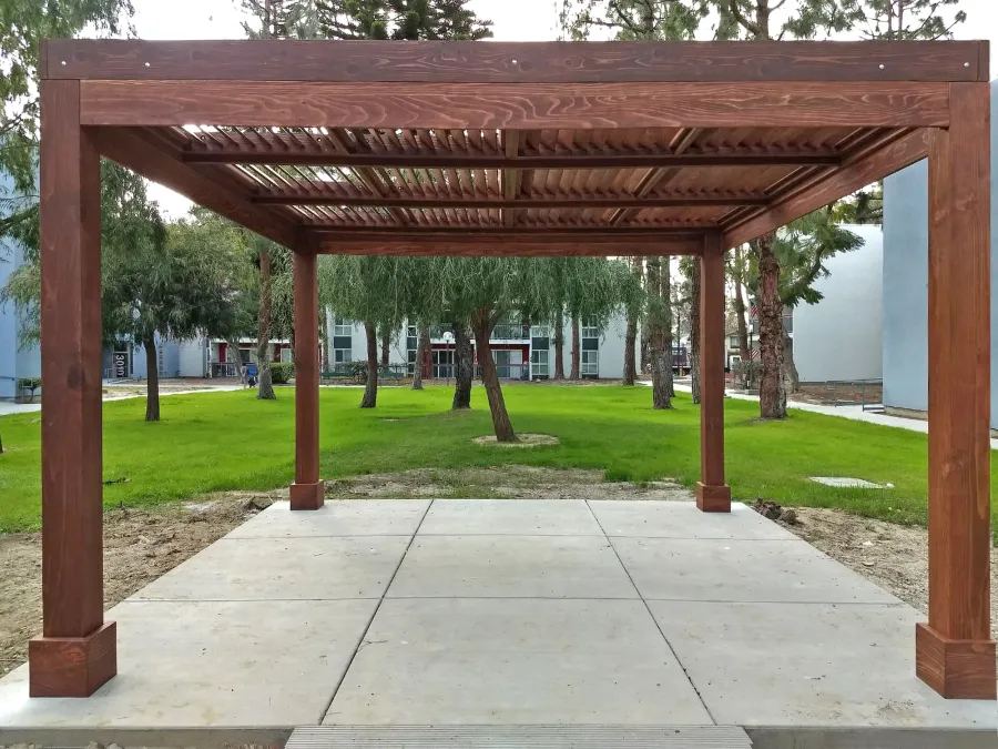 Modern Louvered Garden Pergola (Options: 14' L x 14' W, 8'' x 8'' Posts, Fixed Louvers, California Redwood, 9.5 ft H, No Electrical Wiring Trim, 4 Post Anchor Kit for Concrete, No post decorative trims, With a Ceiling Fan Base, Coffee-Stain Premium Sealant). Photo Courtesy of M. Ramirez of Long Beach, CA.
