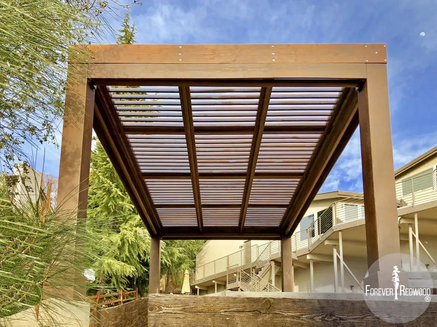 Modern Louvered Garden Pergola (Options: 16' L x 12' W, 10'' x 10'', Fixed Louvers, Douglas-fir, 9.5 ft H, No Electrical Wiring Trim Kit, 4 Post Anchor Kit for Concrete, No Post Decorative Trims, No Ceiling Fan Base, 4 Curtain Rods, Coffee Stain Sealant). Photo Courtesy of R. McCan of El Dorado Hills, CA