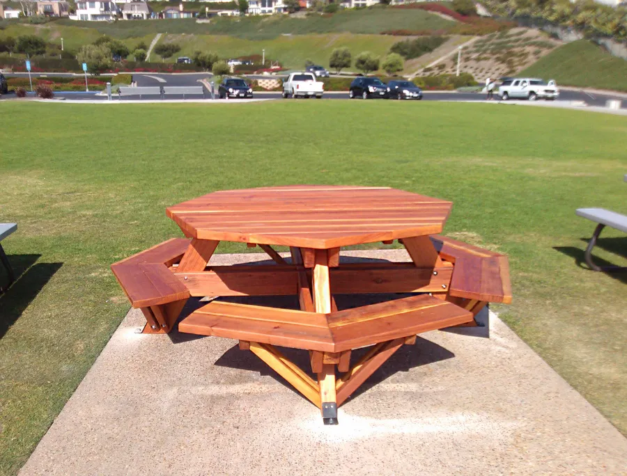 Octagonal Picnic Table (Options: 5 1/2' Diameter Tabletop, Attached Benches, California Redwood, Standard Tabletop, 1 5/8" Umbrella Hole, Transparent Premium Sealant). Photo Courtesy of G. Cooley of Dana Point, CA.