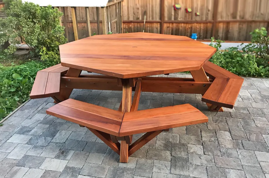 Octagonal Picnic Table (Options: 6' Diameter Tabletop, Attached Benches, California Redwood, Standard Tabletop, Slightly Rounded Corners, 1 5/8" Umbrella Hole, Transparent Premium Sealant). Photo Courtesy of N. Sofia of Pacifica, CA.