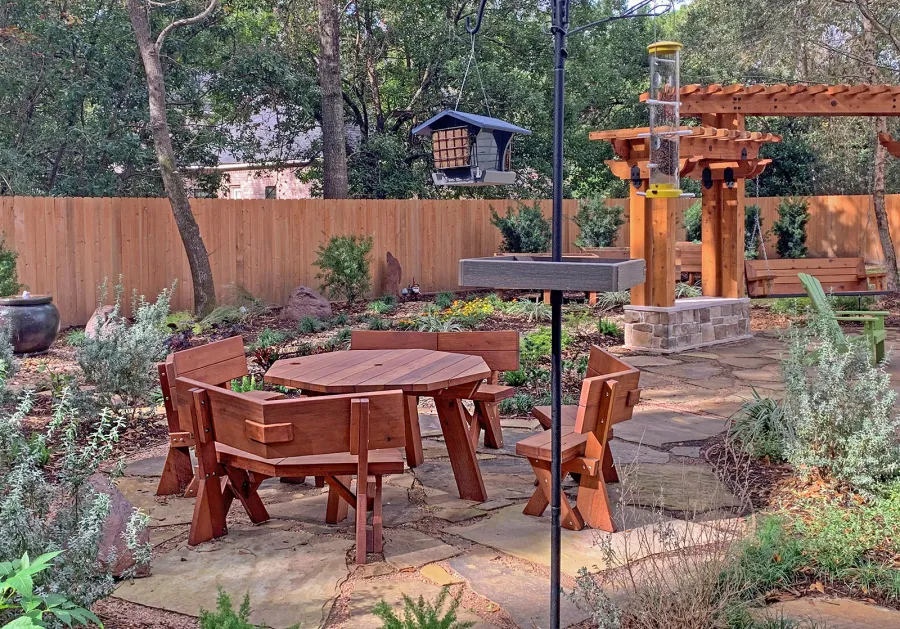 Octagonal Picnic Table (Options: 5' Diameter Tabletop, Unattached Benches [Benches with Backrests by Custom Request], Mature Redwood, Standard Tabletop, Rounded Corners, 1 5/8" Umbrella Hole, Transparent Premium Sealant). Photo Courtesy of Don and Rhonda Martone of Spring, Texas.