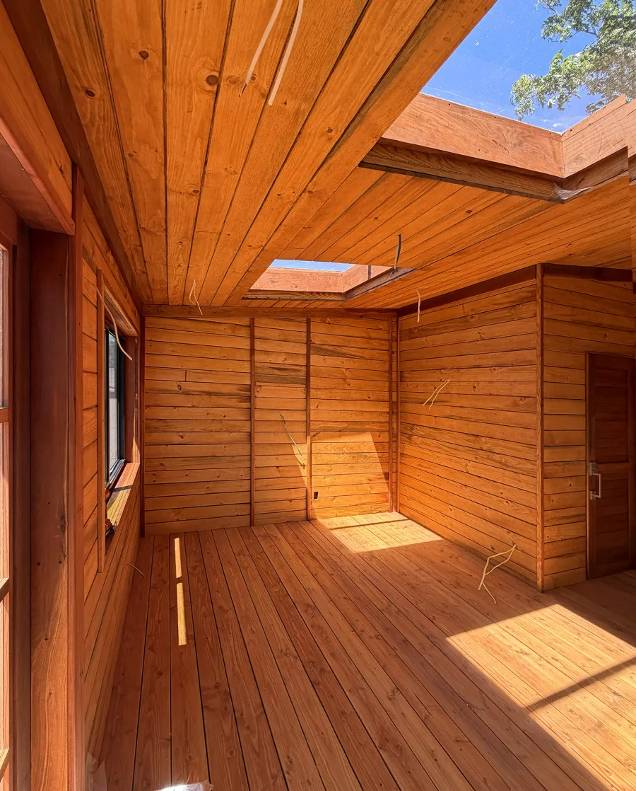 Custom Palo Alto Backyard Cabin (Options: 18' L, 16' W, With 19' x 19' Structural Deck with Steps, California Redwood for Exterior Finished, Douglas-fir Internal Walls and Framing, Double Door, Slidding Windows, Windows Purchased Locally, With Two 2' x 2' Skylights, Metal Roof, Electrical Wire Trim on the Walls, Transparent Premium Sealant). Photo Courtesy of R. and M. Hegwood of Ceres, CA.