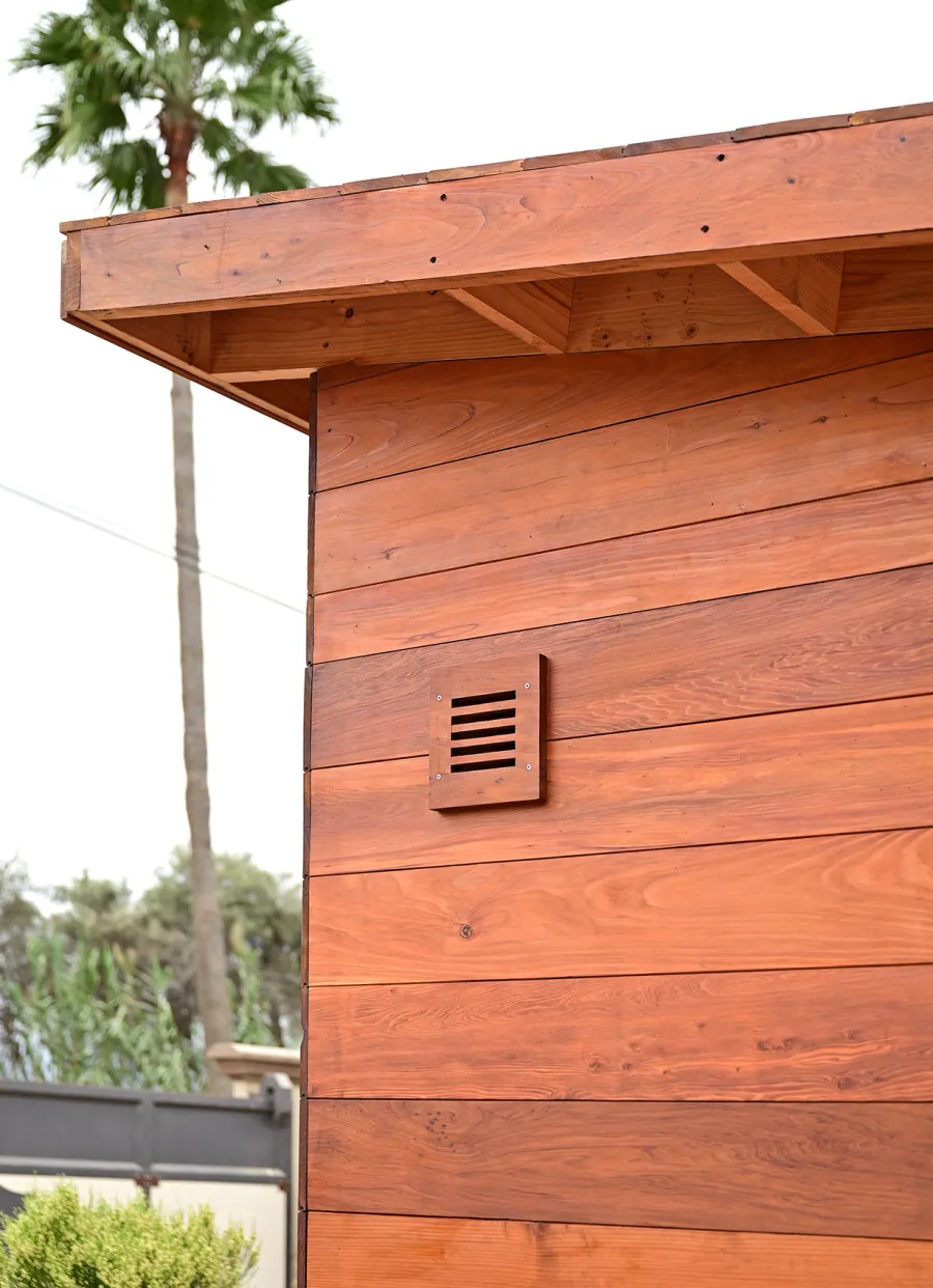 Raul’s Rad Redwood Sauna (Options: 11' W, 8' D, 11' H, California Redwood (for Interiors) & Mature Redwood (for Exteriors), Pitch Roof for Exterior Areas, "L" Shape Bench (2 levels), Transparent Premium Sealant).