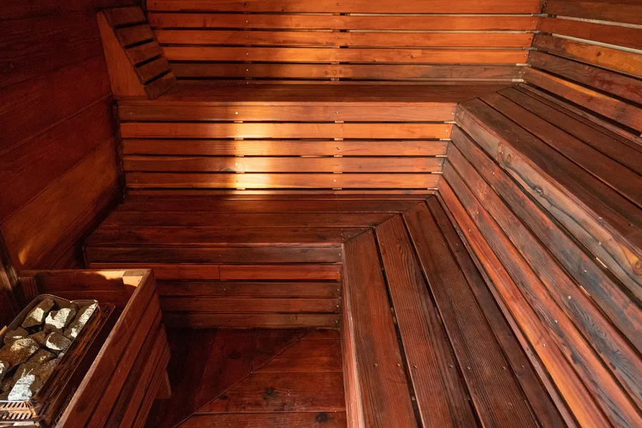 Raul’s Rad Redwood Sauna (Options: 11' W, 8' D, 11' H, California Redwood (for Interiors) & Mature Redwood (for Exteriors), Pitch Roof for Exterior Areas, "L" Shape Bench (2 levels), Transparent Premium Sealant).