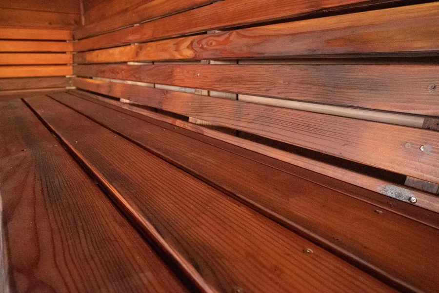 Raul’s Rad Redwood Sauna (Options: 11' W, 8' D, 11' H, California Redwood (for Interiors) & Mature Redwood (for Exteriors), Pitch Roof for Exterior Areas, "L" Shape Bench (2 levels), Transparent Premium Sealant).