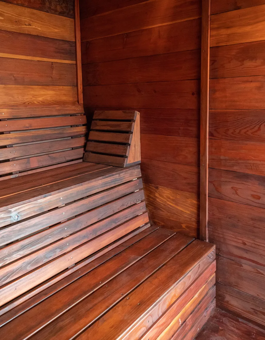 Raul’s Rad Redwood Sauna (Options: 11' W, 8' D, 11' H, California Redwood (for Interiors) & Mature Redwood (for Exteriors), Pitch Roof for Exterior Areas, "L" Shape Bench (2 levels), Transparent Premium Sealant).