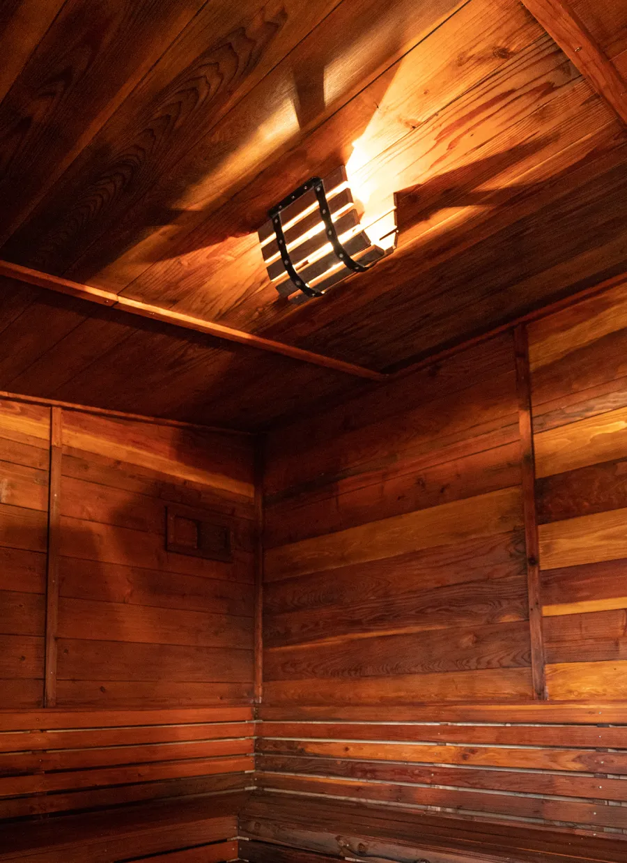 Raul’s Rad Redwood Sauna (Options: 11' W, 8' D, 11' H, California Redwood (for Interiors) & Mature Redwood (for Exteriors), Pitch Roof for Exterior Areas, "L" Shape Bench (2 levels), Transparent Premium Sealant).