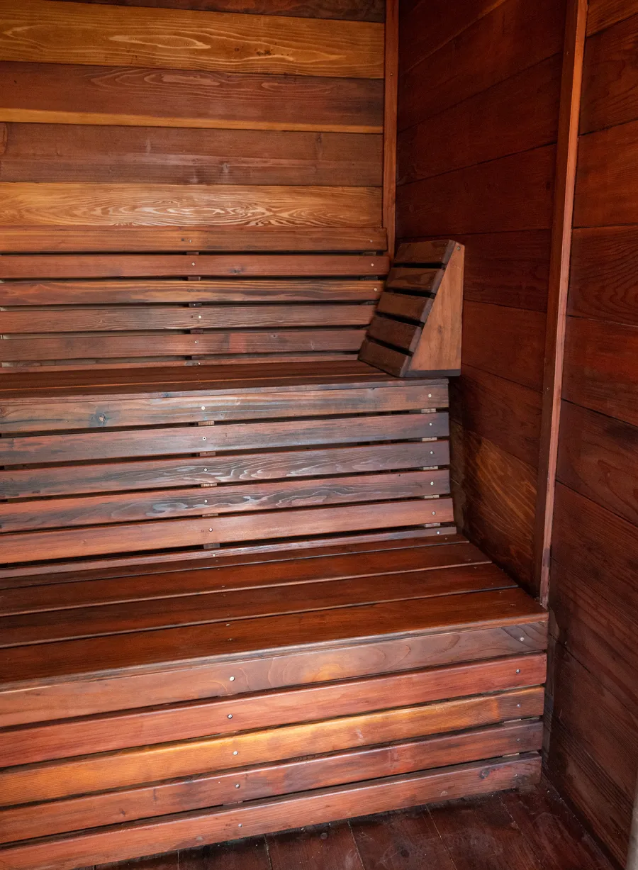 Raul’s Rad Redwood Sauna (Options: 11' W, 8' D, 11' H, California Redwood (for Interiors) & Mature Redwood (for Exteriors), Pitch Roof for Exterior Areas, "L" Shape Bench (2 levels), Transparent Premium Sealant).