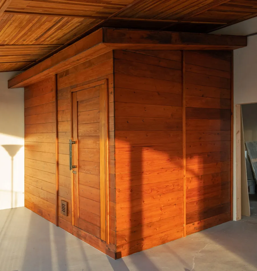 Raul’s Rad Redwood Sauna (Options: 11' W, 8' D, 11' H, California Redwood (for Interiors) & Mature Redwood (for Exteriors), Pitch Roof for Exterior Areas, "L" Shape Bench (2 levels), Transparent Premium Sealant).