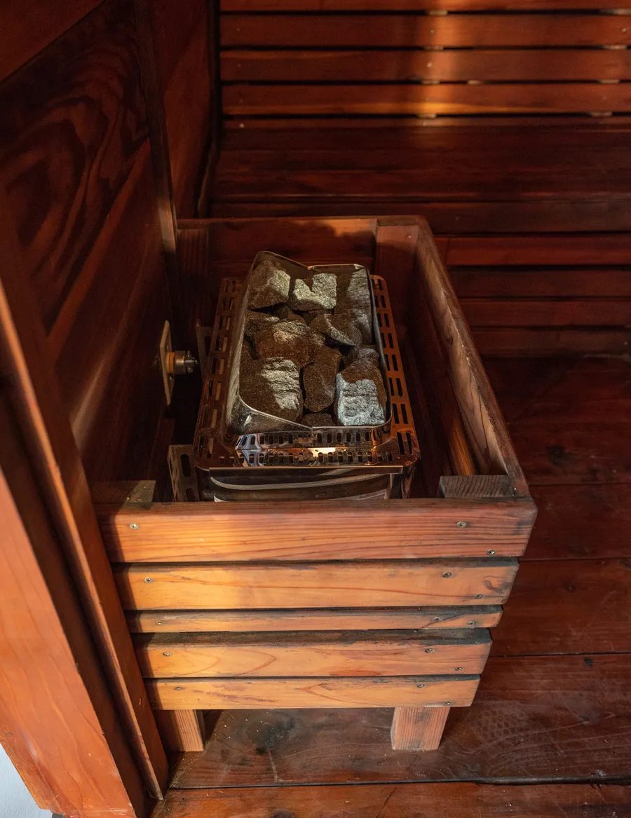 Raul’s Rad Redwood Sauna (Options: 11' W, 8' D, 11' H, California Redwood (for Interiors) & Mature Redwood (for Exteriors), Pitch Roof for Exterior Areas, "L" Shape Bench (2 levels), Transparent Premium Sealant).