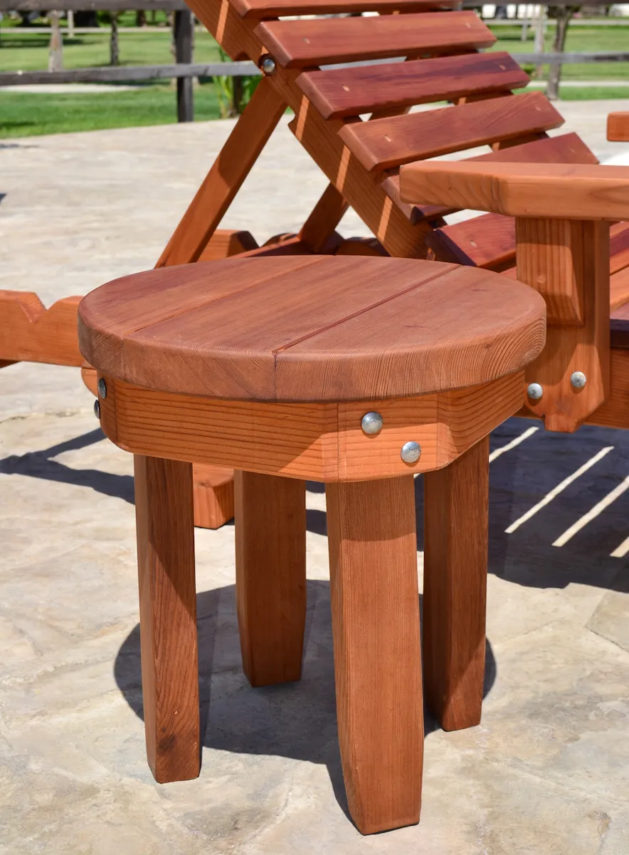Round Solid Wood Side Table (Options: 18" size, Old-Growth Redwood, Rounded Apron, 18"H, Transparent Premium Sealant). Photo also shows The Poolside Privacy Panel and Sol Lounger.