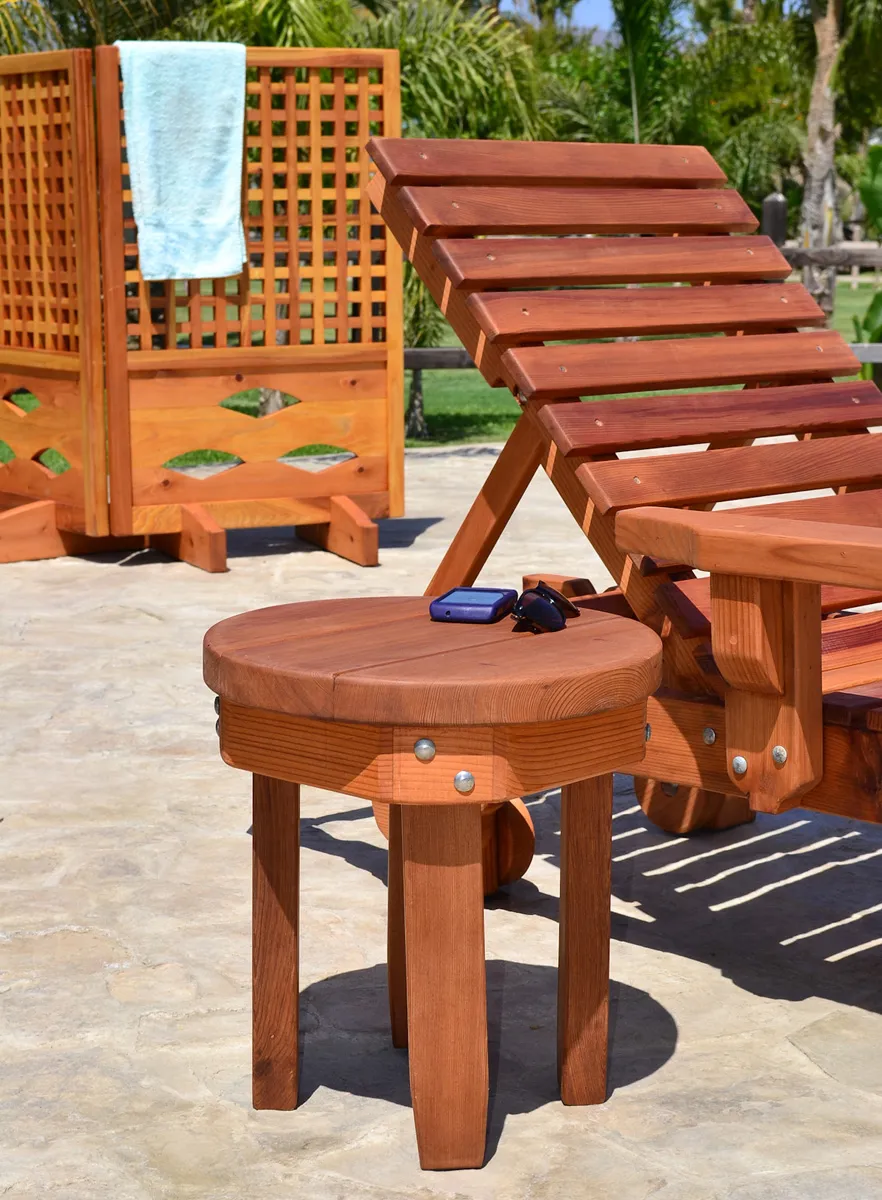 Round Solid Wood Side Table (Options: 18" size, Old-Growth Redwood, Rounded Apron, 18"H, Transparent Premium Sealant). Photo also shows The Poolside Privacy Panel and Sol Lounger.
