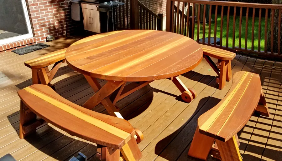 Round Wood Picnic Table with Wheels (Options: 5' Diameter, Unattached Benches, Redwood, Round Picnic Benches, Standard Tabletop, No Lazy Susan, 1 5/8" Umbrella Hole & Plug, Transparent Premium Sealant). Photo Courtesy of A. Adler of Hempstead, New York.